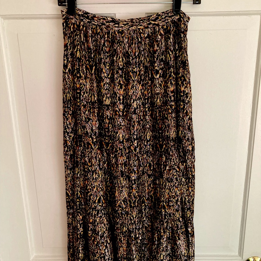 Black and gold-flecked overlay on sheer black skirt